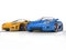 Blue and yellow sportscars on reflective background
