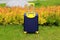 Blue yellow travel suitcase with beautiful nature, relaxing vacation, holidays, weekends and travel. Suitcase near hotel, hostel,