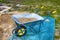 Blue and yellow wheelbarrow for transporting sand