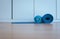 Blue yoga mat half rolled after a workout equipment