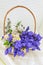 Bluebell flowers bouquet in wicker basket