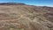 Bluebell knoll summit Utah, car drives on scenic highway, wide drone shot