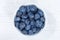 Blueberries berries from above bowl wooden board