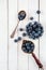 Blueberries or bilberries on a white wooden table