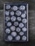 Blueberries on blue plate on gray old wooden table