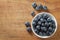 Blueberries in bowl on wooden. Blueberry contain antioxidant organic useful healthy and nutrition.