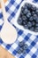 Blueberries on checkered tablecloth