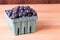 Blueberries in container on table