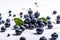 Blueberries falling on to a white surface with leaves and water droplets. Created with Generative AI