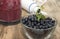 Blueberries in a glass bowl and blender