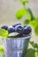 Blueberries, juicy wild berries in drops of water. Healthy food or nutrition