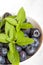 Blueberries, leaves of fresh mint.