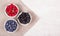 Blueberries, raspberries and blackberries on white background. Blueberry raspberry blackberry in white bowl.