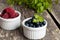 Blueberries and raspberries bowl on wooden table
