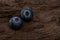 Blueberries ripe and tasty on a dark wooden table