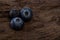 Blueberries ripe and tasty on a wooden table