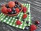 Blueberries, strawberries gourmet apricot assorted freshness group rustic cherry organic freshness towel on an old black wooden