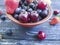 Blueberries, strawberries raw snack vitamin group rustic cherry sweet on an old black wooden