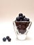 Blueberries in a triangular glass