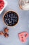 Blueberries in a wooden bowl and heart shape