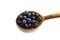 Blueberries in a wooden spoons isolated on a white background. White background with blueberries. Blueberry border