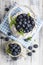 Blueberry basket and jug on white wooden table