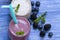 Blueberry and blackberry smoothie on blue wooden background. milkshake with fresh berries. healthy fruit smoothie with