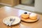 Blueberry Donut and Coconut Donut with powder serve on wooden.