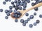 Blueberry fruit vitamins in a wooden spoon