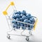 Blueberry fruits in mini shopping cart. Selective focus on the blueberries in small trolley.