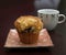 Blueberry muffin and cappuccino cup