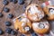 Blueberry muffins closeup on a table. horizontal top view