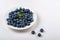 Blueberry plate on white background. Healthy food for breakfast.