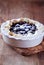 Blueberry Quiche ina Ceramic Dish on rustic wooden background.