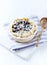 Blueberry Quiche ina Ceramic Dish on white wooden background.