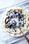 Blueberry Quiche ina Ceramic Dish on white wooden background.