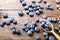 Blueberry scattered on a wooden background