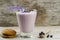 Blueberry smoothie with berries, oat cookies on wooden background. Healthy vegetarian food