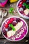 Blueberry smoothie bowl with banana, raspberry, pitaya, blackberry, almonds, sunflower and chia seeds