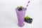 Blueberry smoothies fruit juices and blueberries on a white wooden backgroun. Drink in the morning for good health.