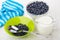 Blueberry, spoon in bowl, napkin, bowl with blueberries, milk