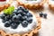 Blueberry tart on table, closeup. Delicious