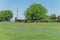 Bluebonnet blossom in countryside Texas with farm barns