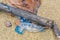 Bluebottle Jellyfish with tentacles washed up on a stick the beach