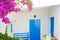 Bluedoor and bougainvilleas in white house