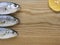 Bluefish on wooden hob with lemon