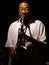 Blues artist playing a saxophone on Beale Street in Memphis, Tennessee