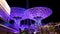 Bluewaters Island at night. Walking area promenade with huge neon glowing trees mushrooms. Jumeirah Beach Residence