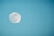 This bluish white full moon in Daylight with Copy Space