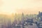 Blur abstract background city morning gold light sky rooftop view over cityscape with bright sun flare and bokeh